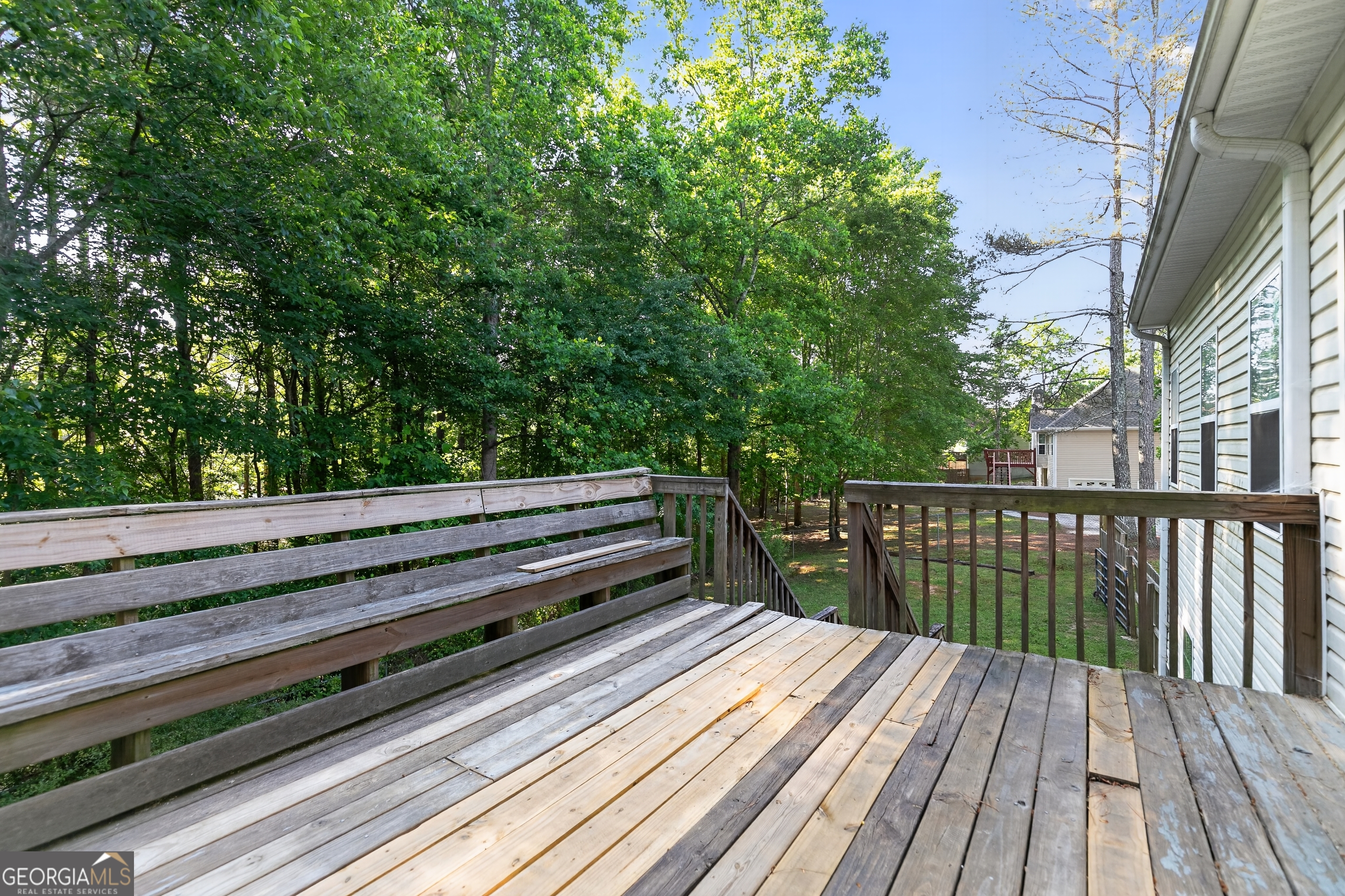 178 Rachel Boulevard Temple, GA 30179 - Photo 5 of 30 a view of balcony with wooden floor and fence