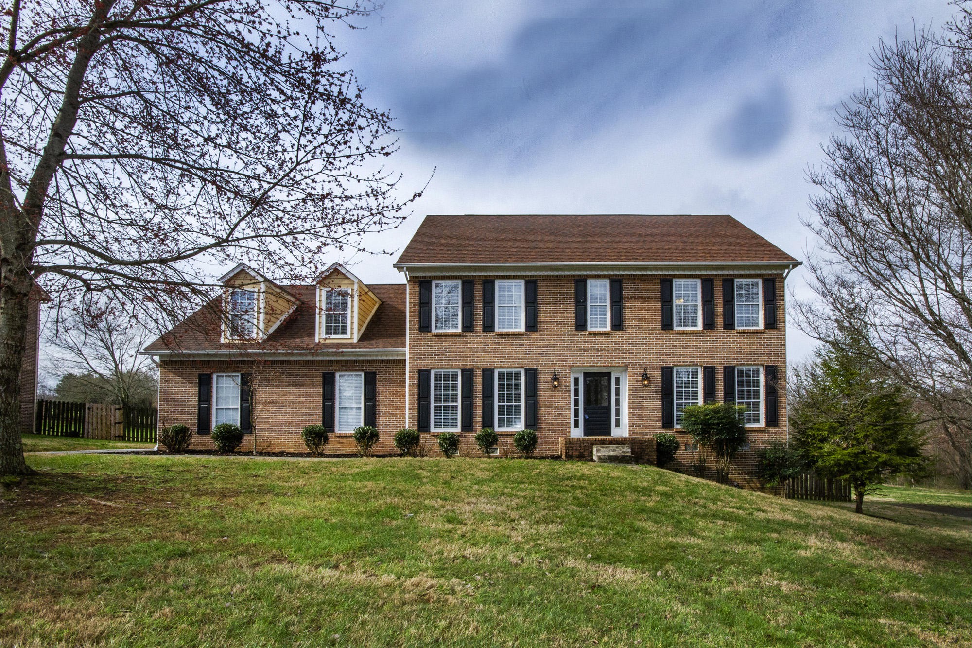 229 Long Bow Road Knoxville, TN 37934 - Photo 1 of 38 a front view of a house with a garden