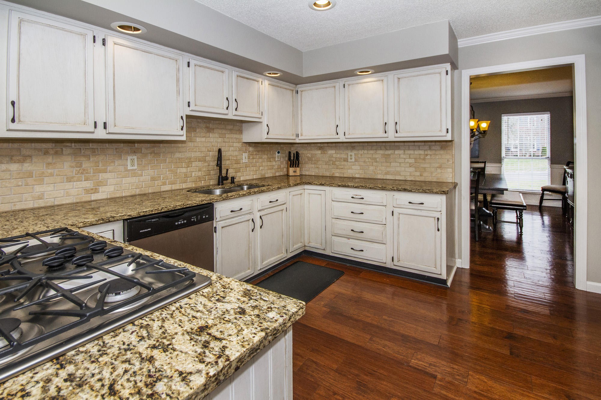 229 Long Bow Road Knoxville, TN 37934 - Photo 14 of 38 a kitchen with stainless steel appliances granite countertop a stove and a sink