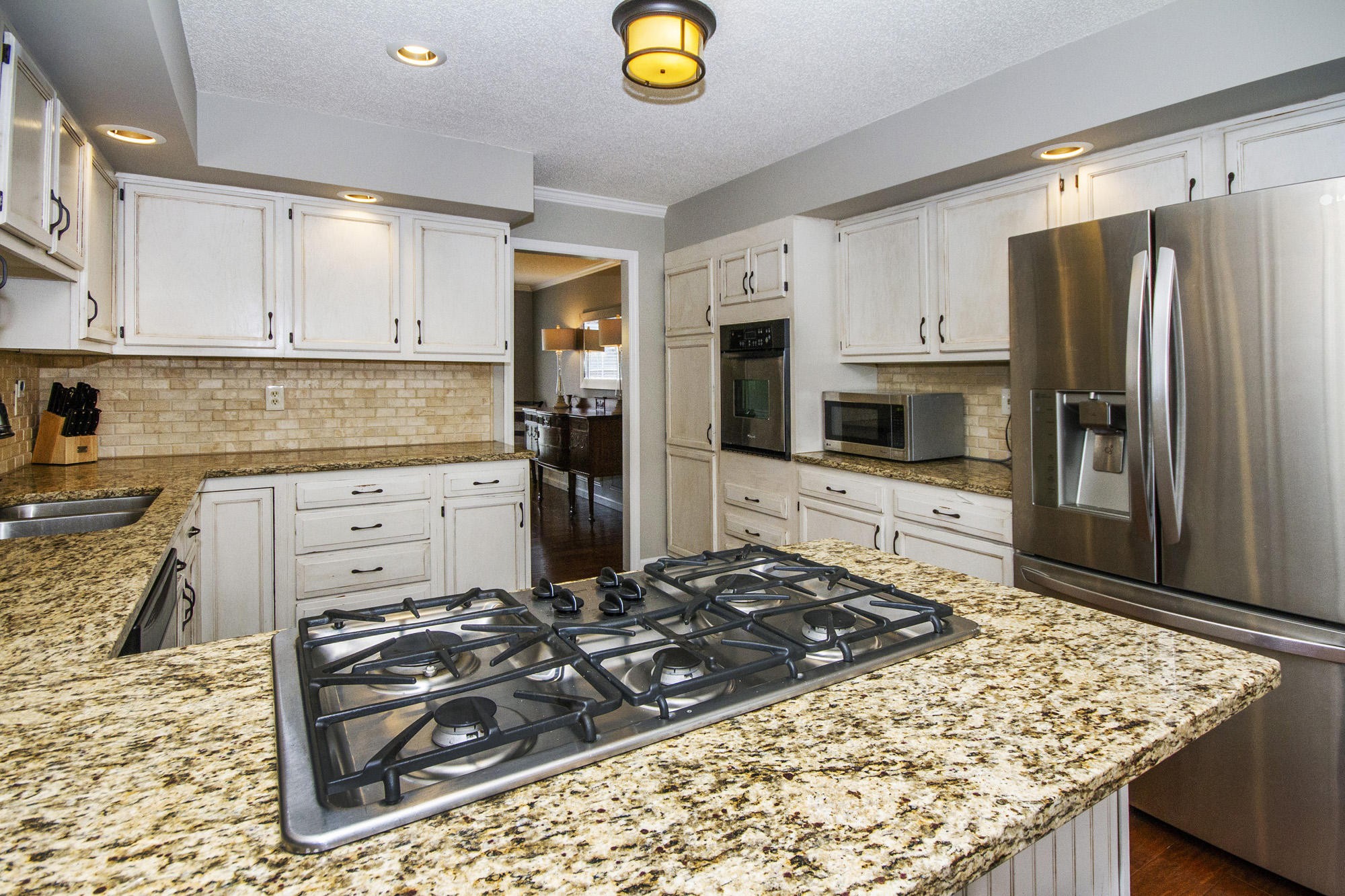 229 Long Bow Road Knoxville, TN 37934 - Photo 15 of 38 a kitchen with stainless steel appliances granite countertop a stove refrigerator and cabinets
