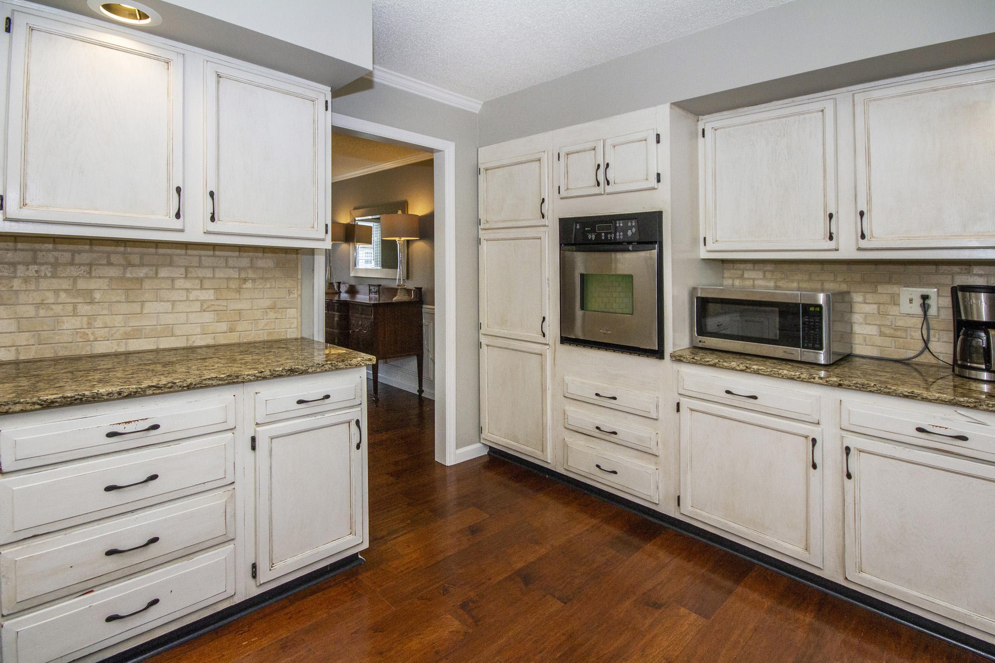 229 Long Bow Road Knoxville, TN 37934 - Photo 16 of 38 a kitchen with granite countertop white cabinets white stainless steel appliances and granite counter tops