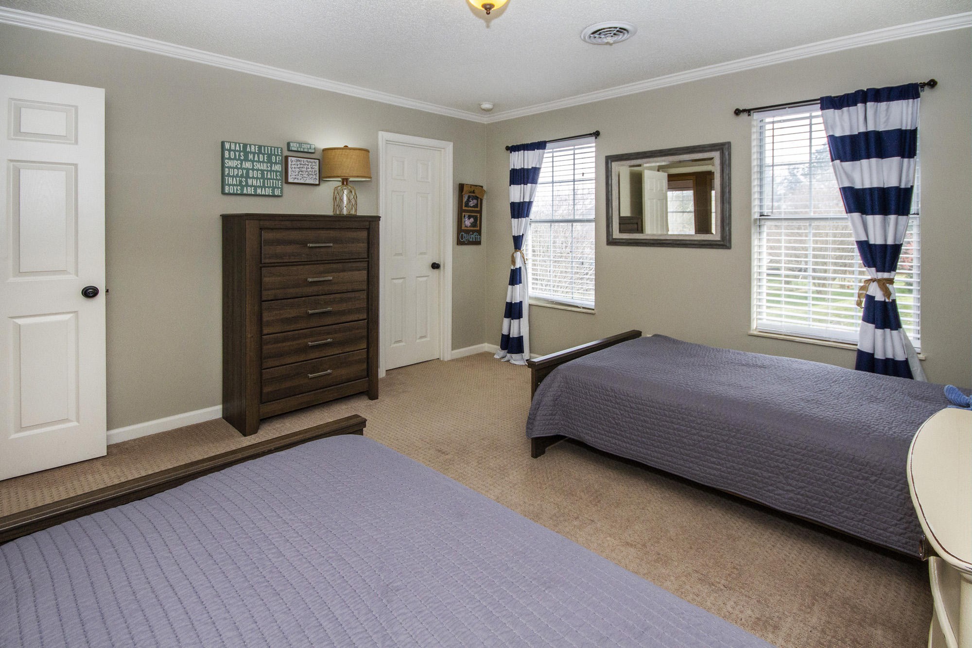 229 Long Bow Road Knoxville, TN 37934 - Photo 30 of 38 a spacious bedroom with a bed and a window
