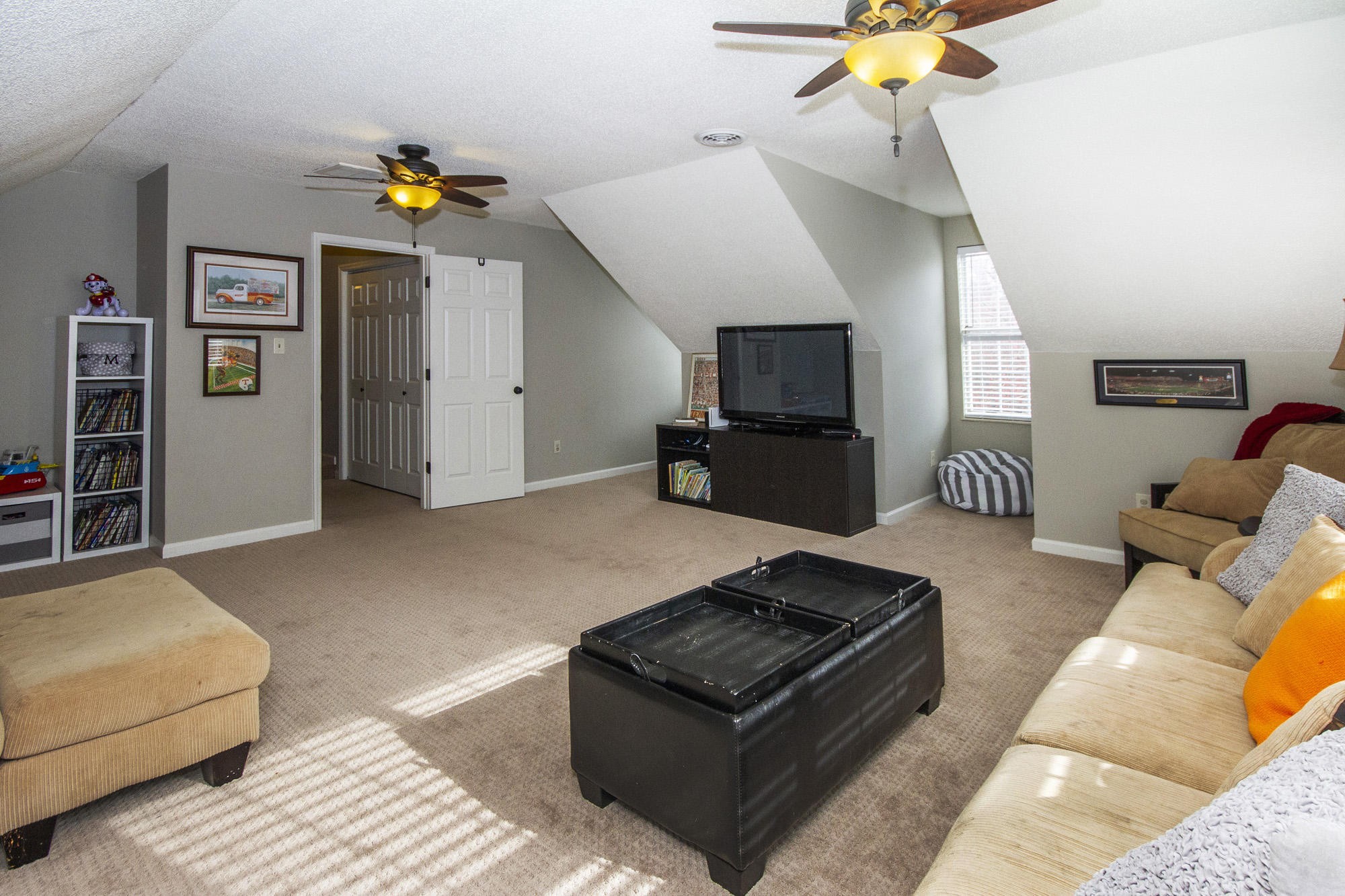 229 Long Bow Road Knoxville, TN 37934 - Photo 32 of 38 a living room with furniture and a flat screen tv