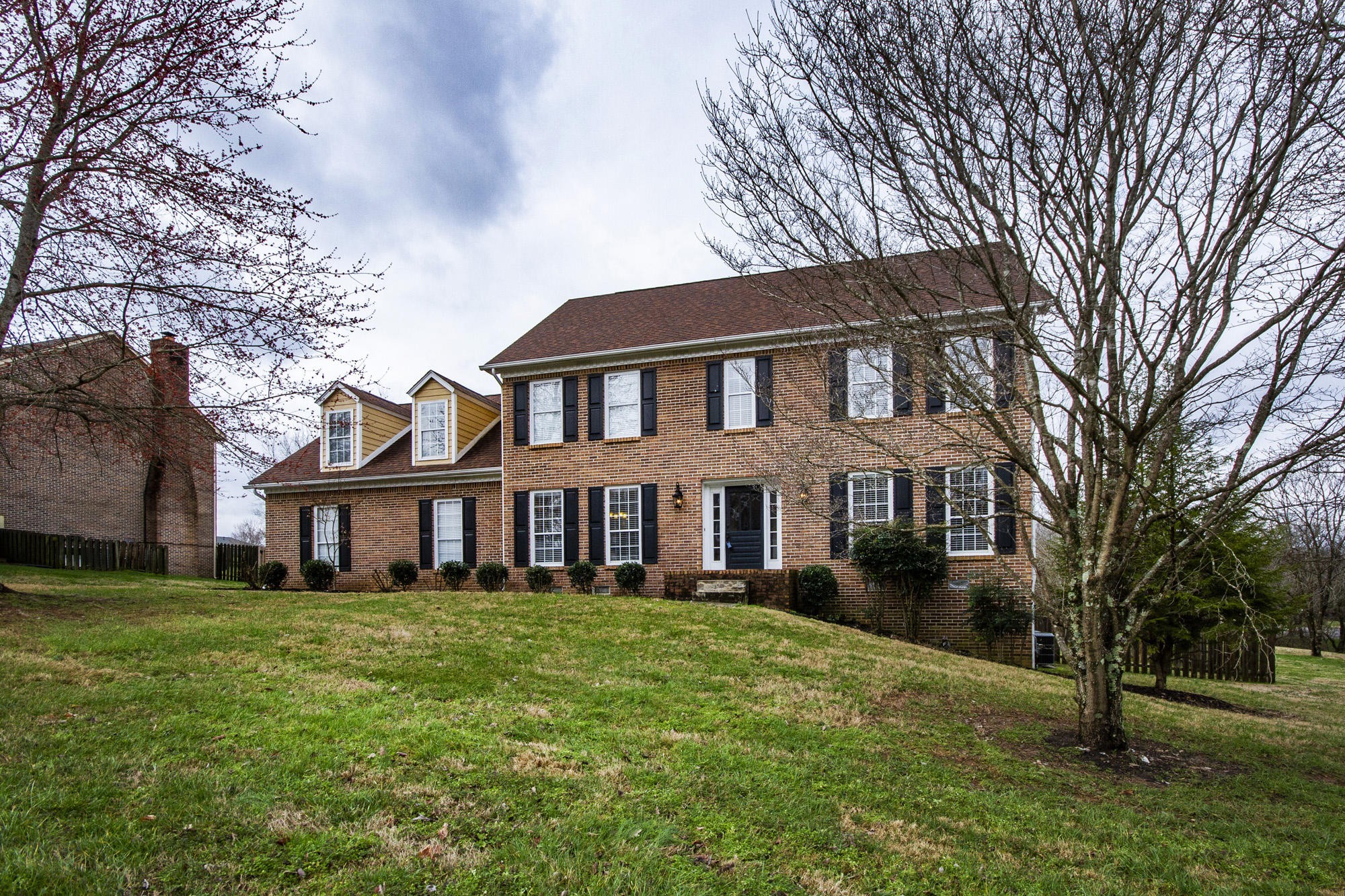 229 Long Bow Road Knoxville, TN 37934 - Photo 38 of 38 a front view of a house with a garden