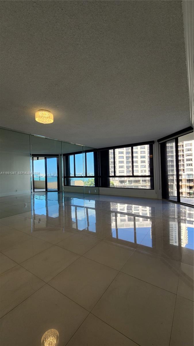 520 Brickell Key Drive, Unit A802 Miami, FL 33131 - Photo 2 of 13 a lobby with furniture and window