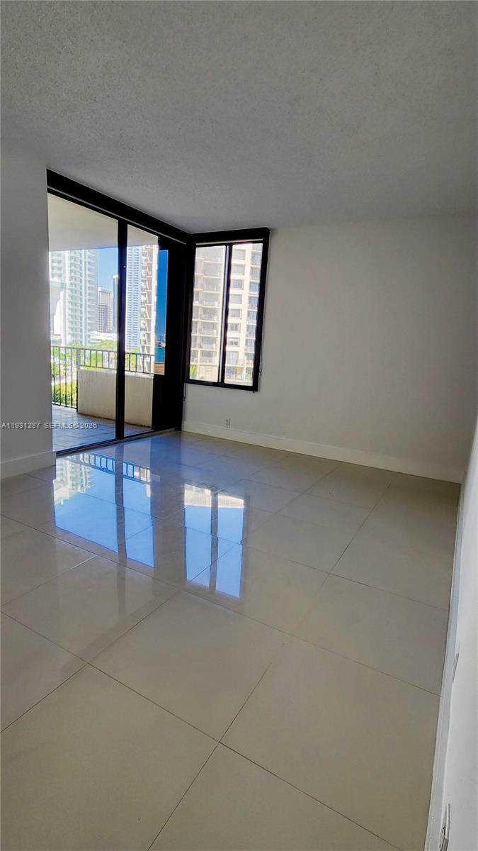 520 Brickell Key Drive, Unit A802 Miami, FL 33131 - Photo 8 of 13 an empty room with windows