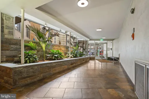 a view of a building with a window and a tree