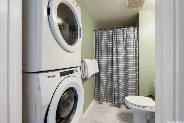 a bathroom with a toilet and a sink