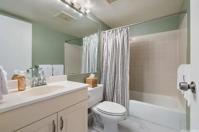 a bathroom with a sink a toilet and a bathtub