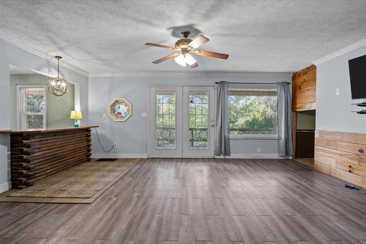 3316 Toms Creek Road Linden, TN 37096 - Photo 15 of 44 a view of an empty room with a window and wooden floor