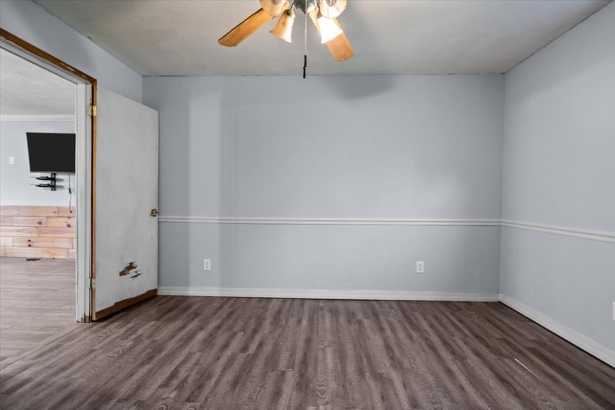 3316 Toms Creek Road Linden, TN 37096 - Photo 18 of 44 an empty room with wooden floor and white walls