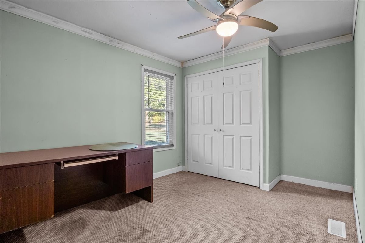 3316 Toms Creek Road Linden, TN 37096 - Photo 20 of 44 an empty room with windows and fan