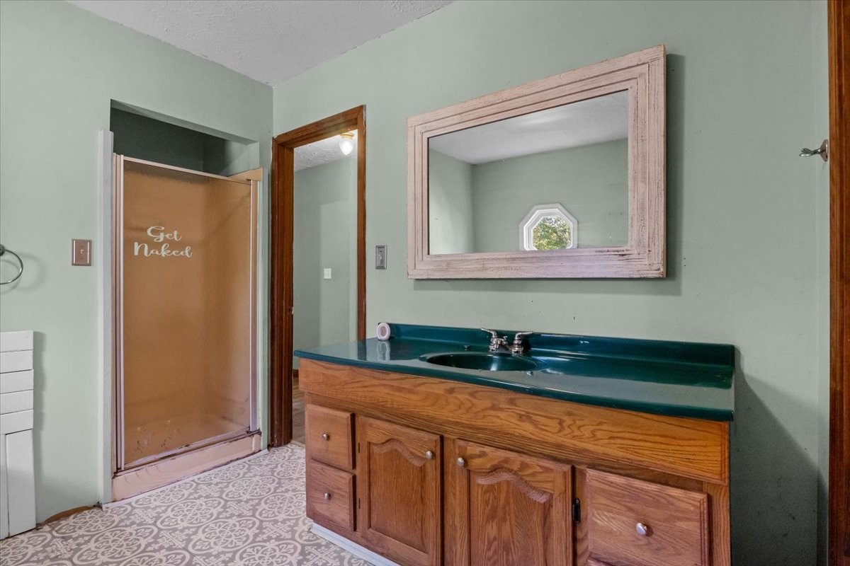 3316 Toms Creek Road Linden, TN 37096 - Photo 22 of 44 a bathroom with a sink a vanity and a mirror