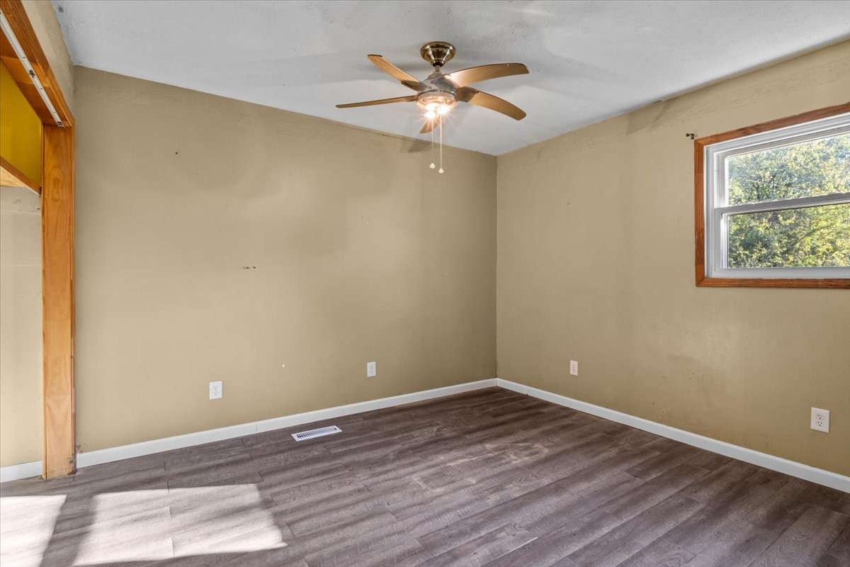 3316 Toms Creek Road Linden, TN 37096 - Photo 24 of 44 a view of an empty room with window and wooden floor