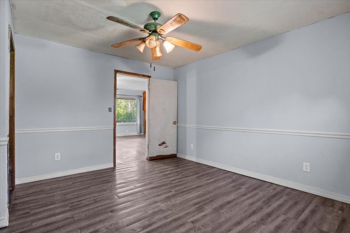 3316 Toms Creek Road Linden, TN 37096 - Photo 35 of 44 an empty room with wooden floor and windows