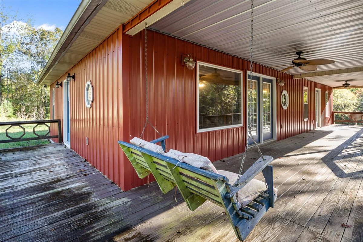 3316 Toms Creek Road Linden, TN 37096 - Photo 4 of 44 a view of a deck with wooden floor and stairs