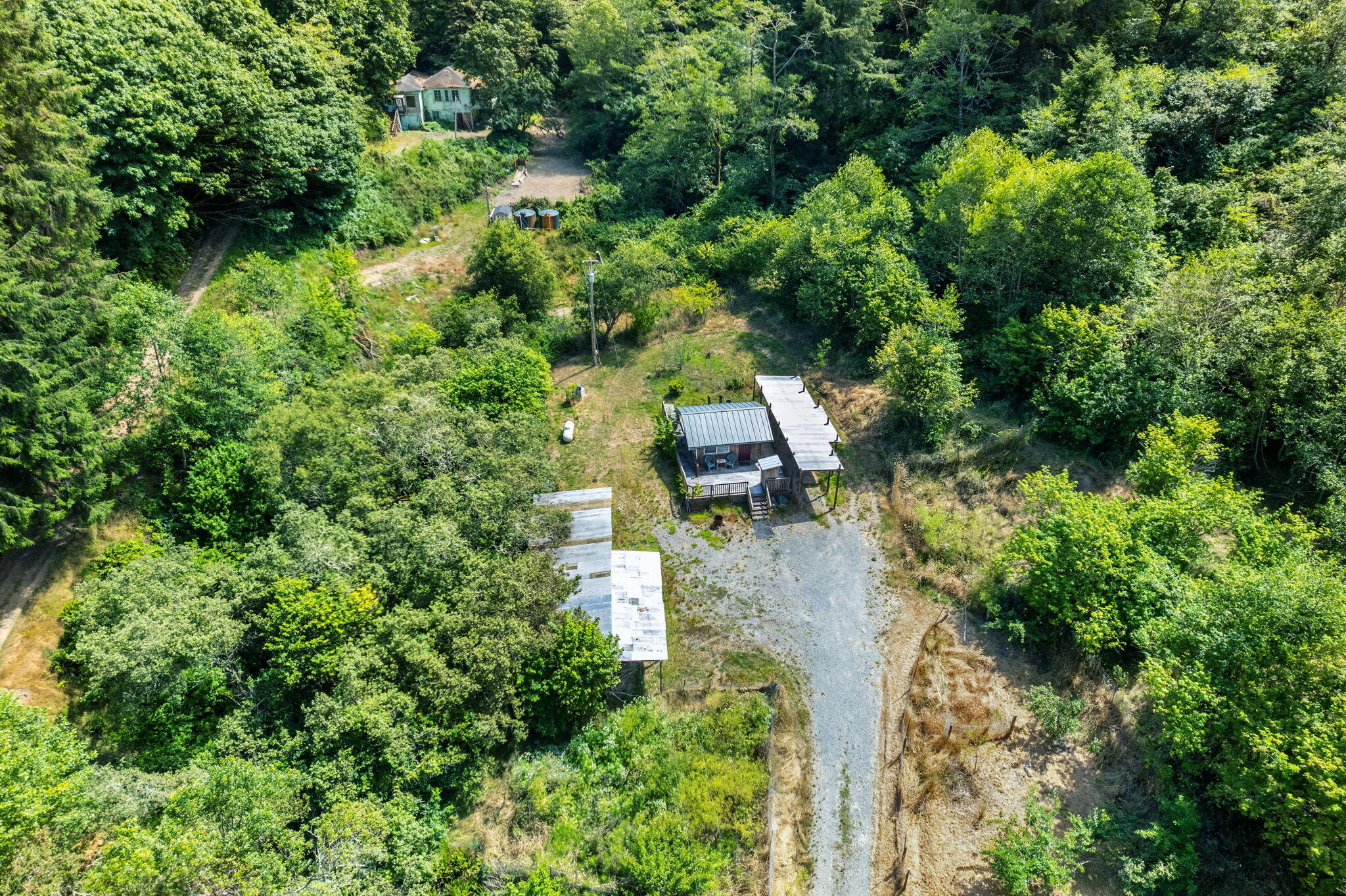 755-763 Oeschger Road Ferndale, CA 95536 - Photo 12 of 36 an aerial view of residential house with outdoor space and trees all around