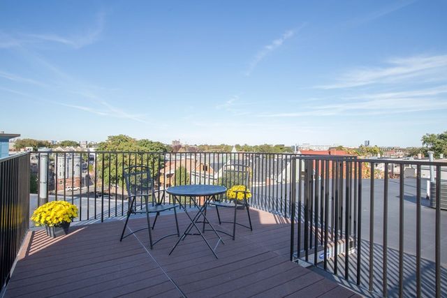 a view of a balcony with chairs