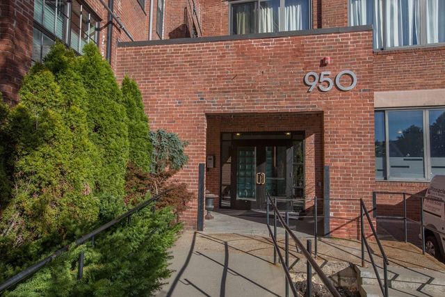 a view of house with yard and outdoor seating