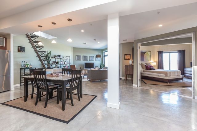 a view of a dining room with furniture and a livingroom