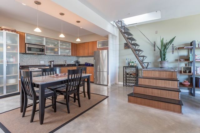 a dining room with furniture and entryway