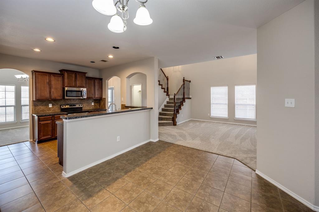 2228 Canyon Point McKinney, TX 75071 - Photo 20 of 40 a view of a kitchen with a sink and cabinets