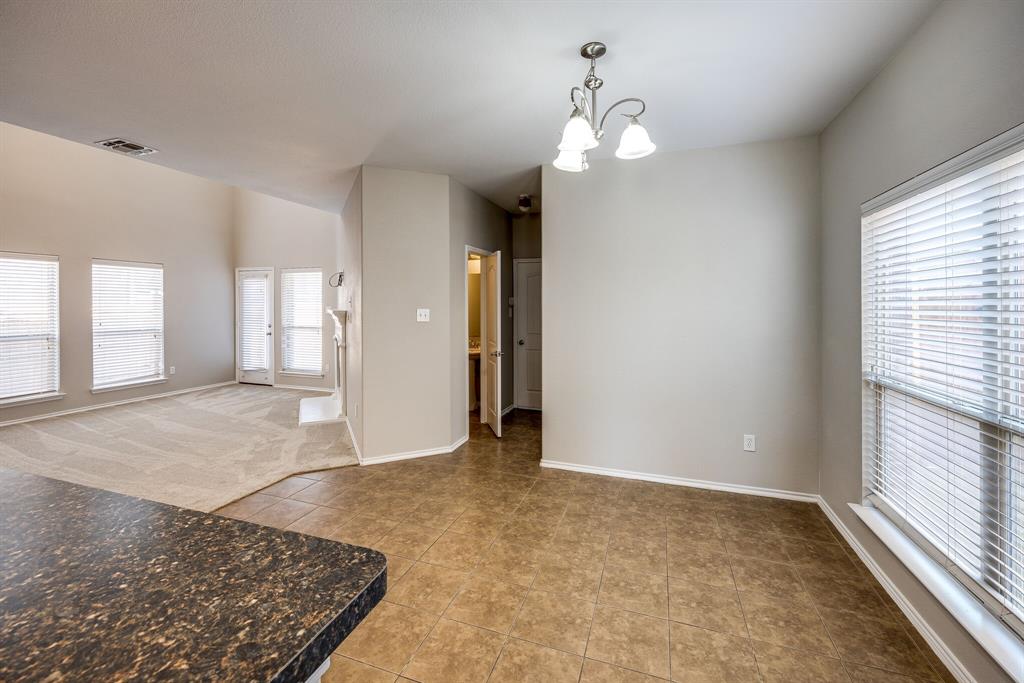2228 Canyon Point McKinney, TX 75071 - Photo 21 of 40 wooden floor in an empty room with a window