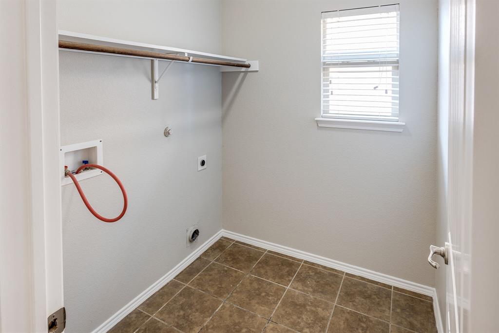 2228 Canyon Point McKinney, TX 75071 - Photo 22 of 40 a bathroom with a glass shower door and a window