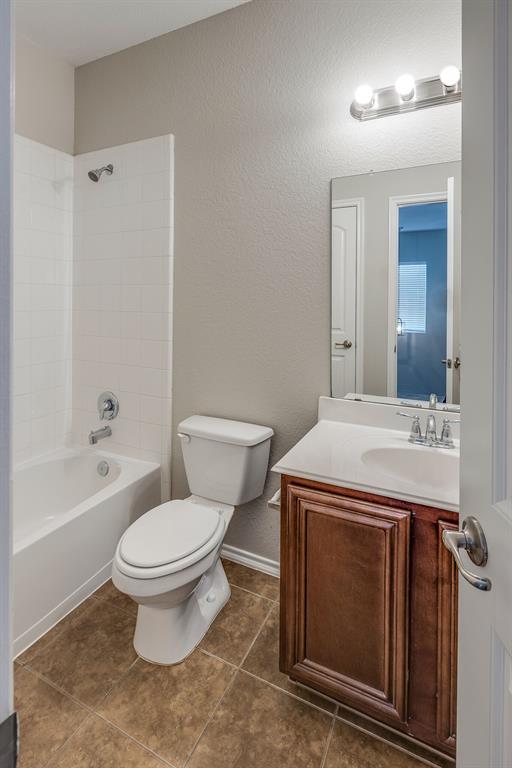 2228 Canyon Point McKinney, TX 75071 - Photo 29 of 40 a bathroom with a sink a toilet and shower