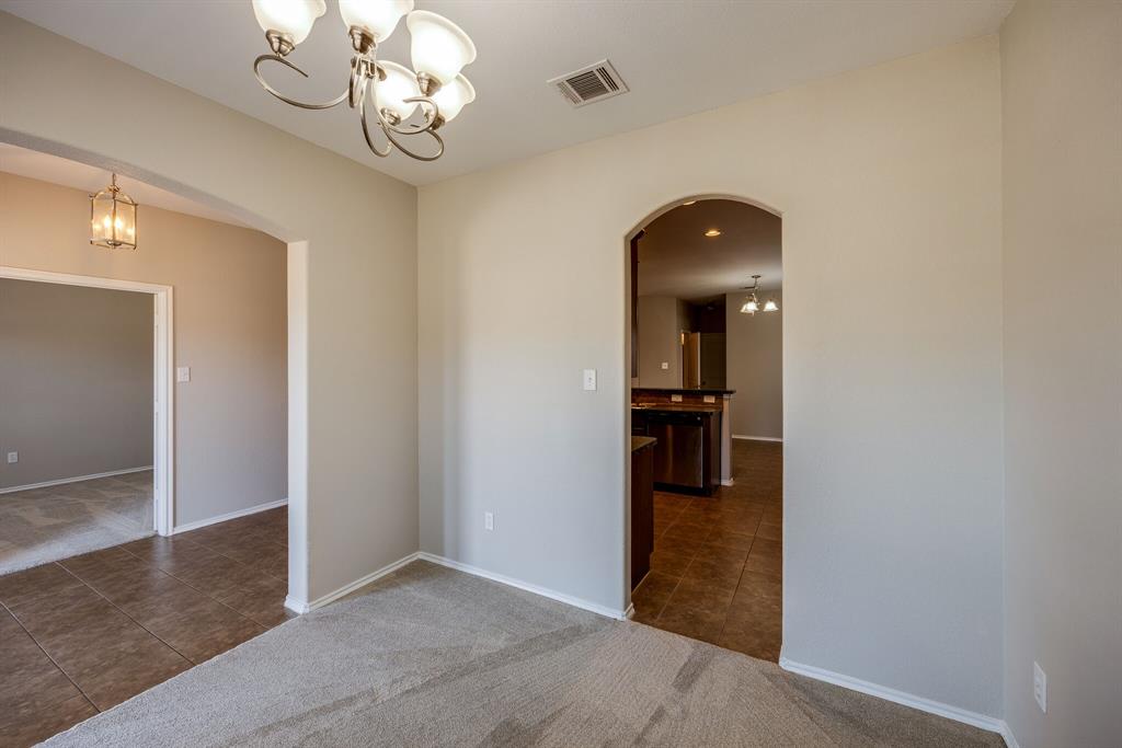 2228 Canyon Point McKinney, TX 75071 - Photo 9 of 40 wooden floor in a hall with a chandelier