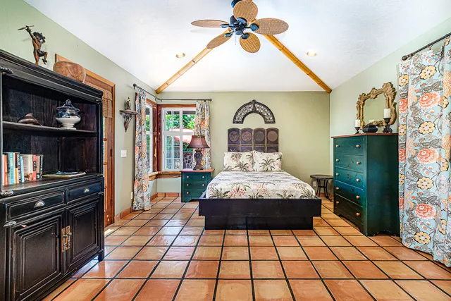 a bedroom with a bed and dresser