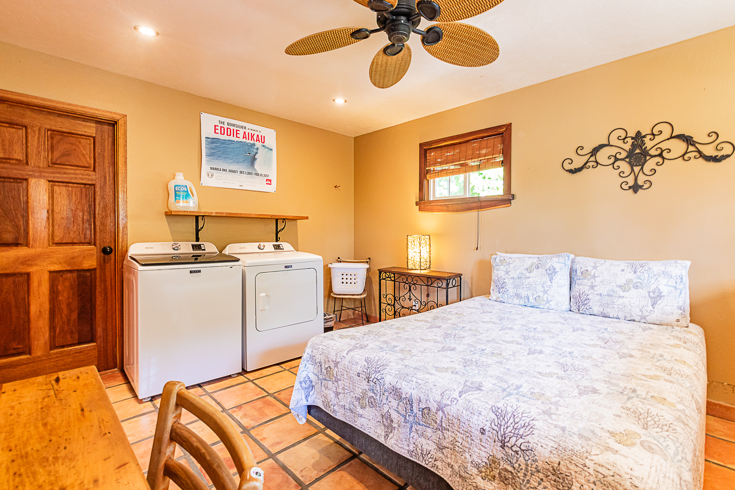 15-869 Lemiwai Road Keaau, HI 96749 - Photo 26 of 30 a bedroom with a bed and a chandelier