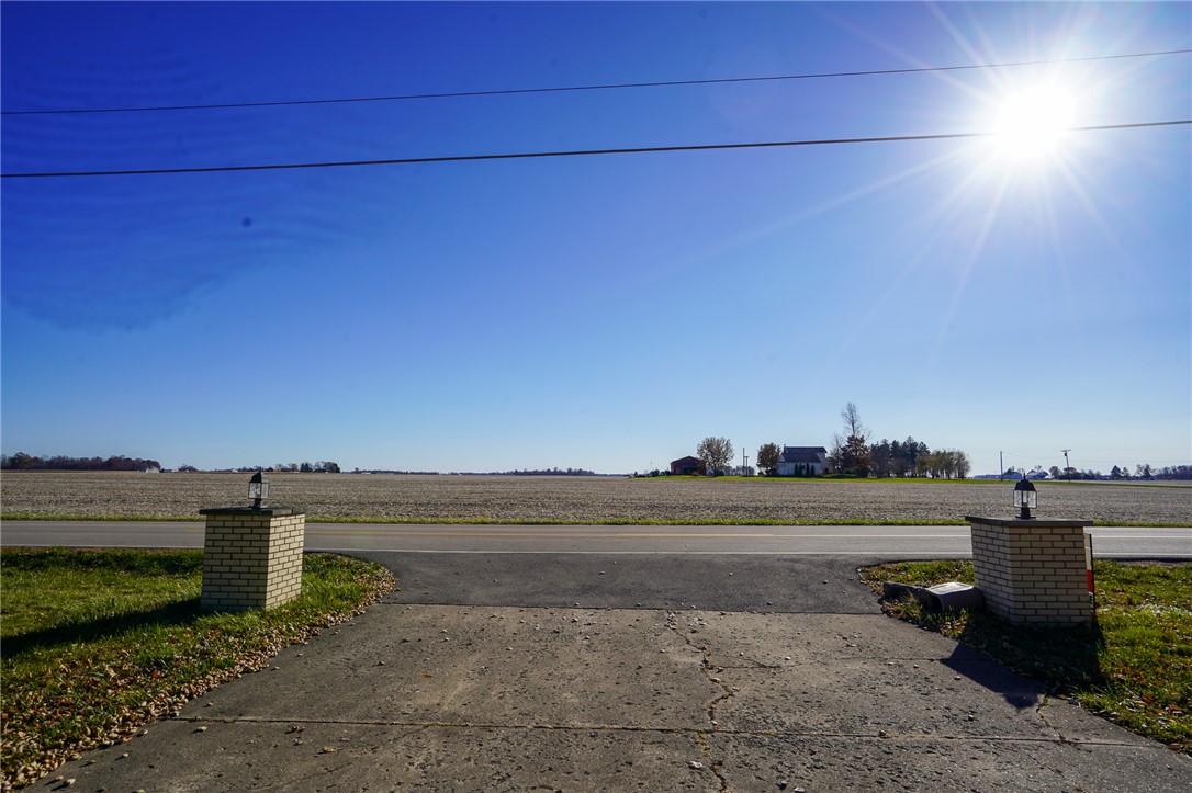 8746 Grubbs-Rex Road Arcanum, OH 45304 - Photo 38 of 38 This expansive lot offers a clear canvas for building, featuring a serene field view and open skies.