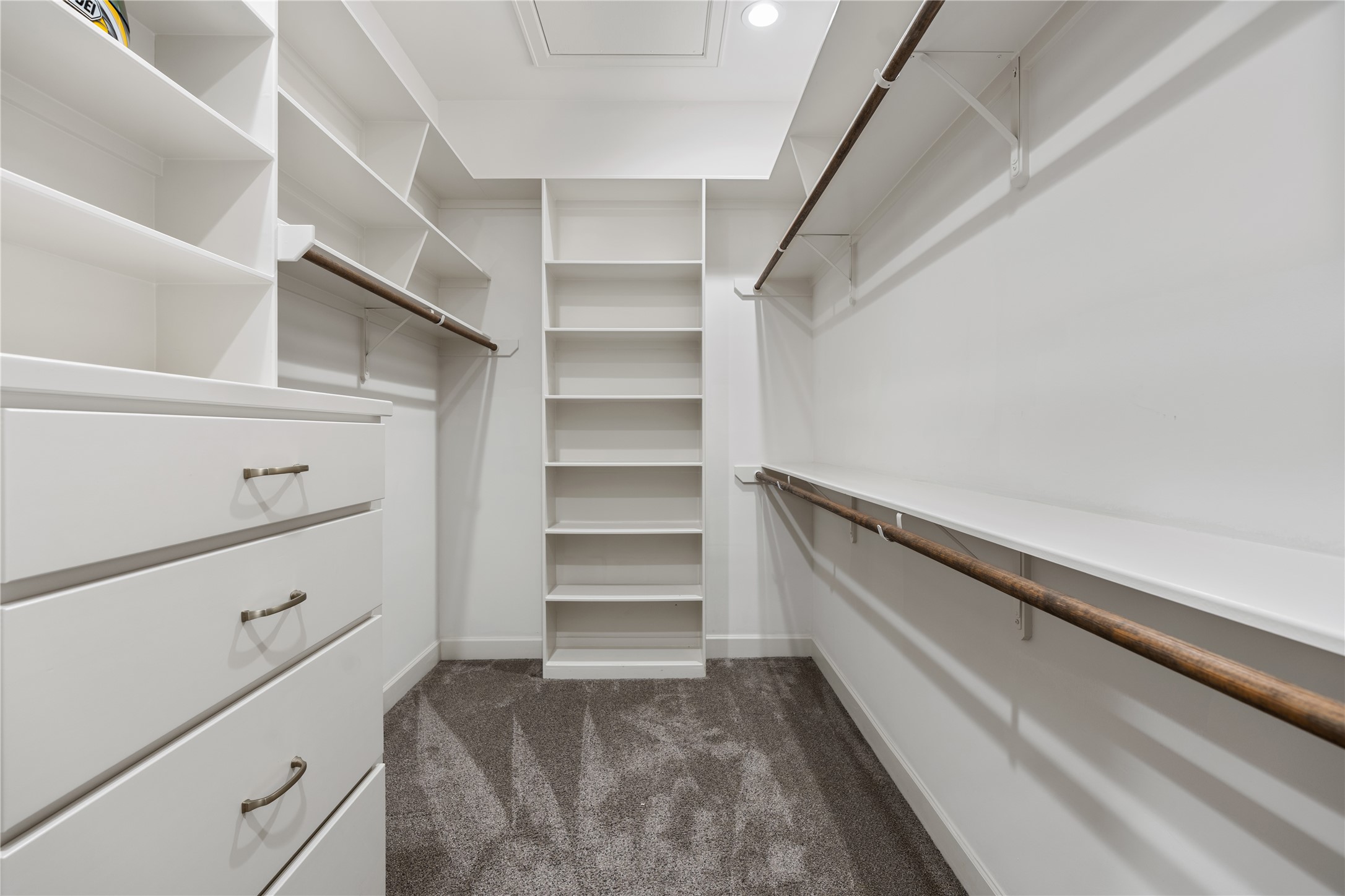 12379 Pebble View Drive Conroe, TX 77304 - Photo 25 of 46 Step inside the walk-in closet, featuring ample shelving, drawers and hanging space.