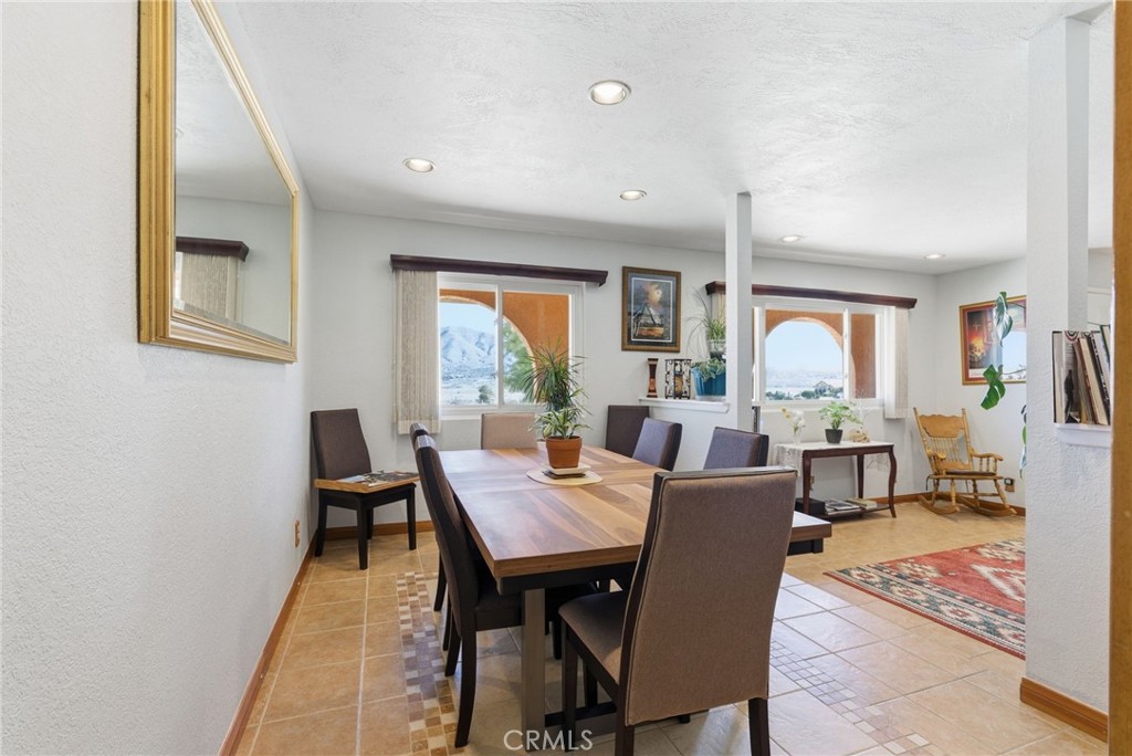 7868 Arrowhead Lake Road Hesperia, CA 92345 - Photo 11 of 48 a view of a dining room with furniture window and wooden floor