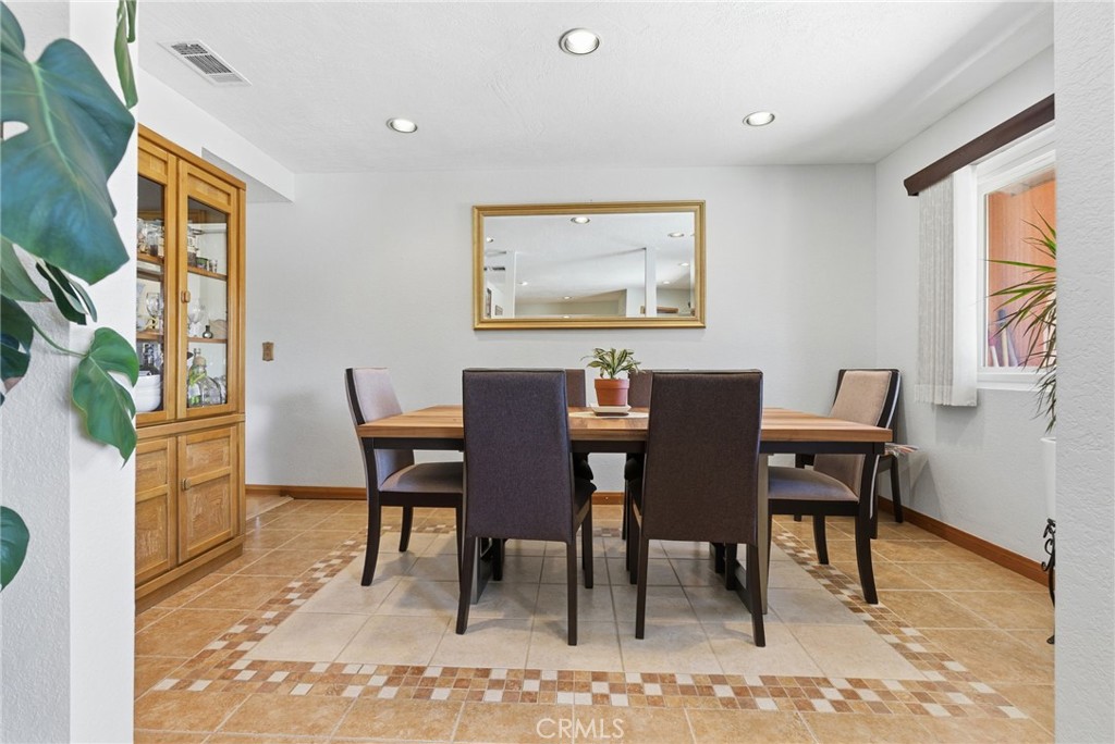 7868 Arrowhead Lake Road Hesperia, CA 92345 - Photo 10 of 48 a view of a dining room with furniture and a rug