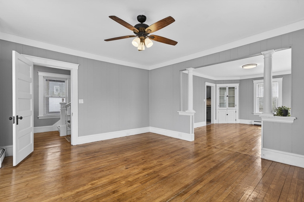 22 Maple Street Templeton, MA 01436 - Photo 14 of 28 a view of an empty room with wooden floor and a ceiling fan