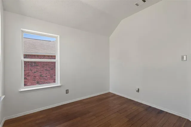 an empty room with a empty space and a window