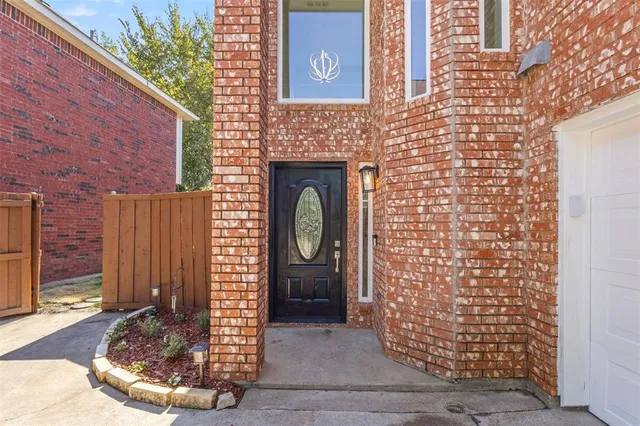 a view of staircase with wooden floor and a window