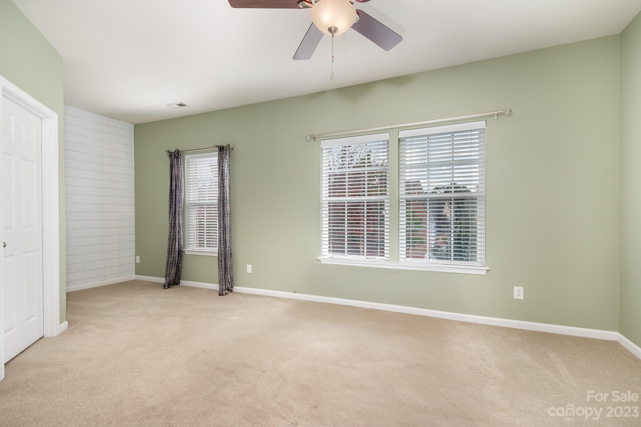 725 Naramore Street Davidson, NC 28036 - Photo 17 of 27 an empty room with windows