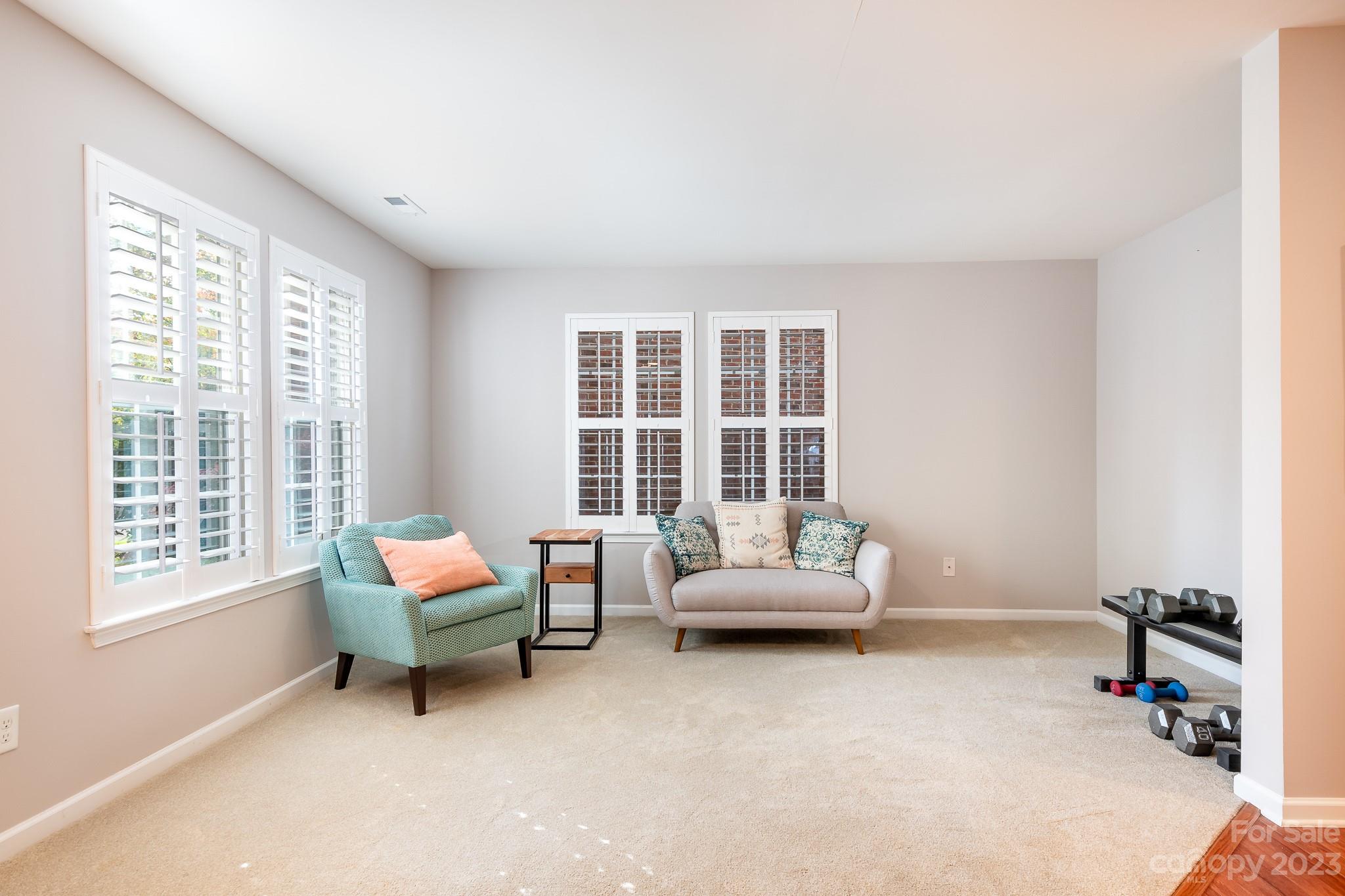 725 Naramore Street Davidson, NC 28036 - Photo 19 of 27 a living room with furniture and a window