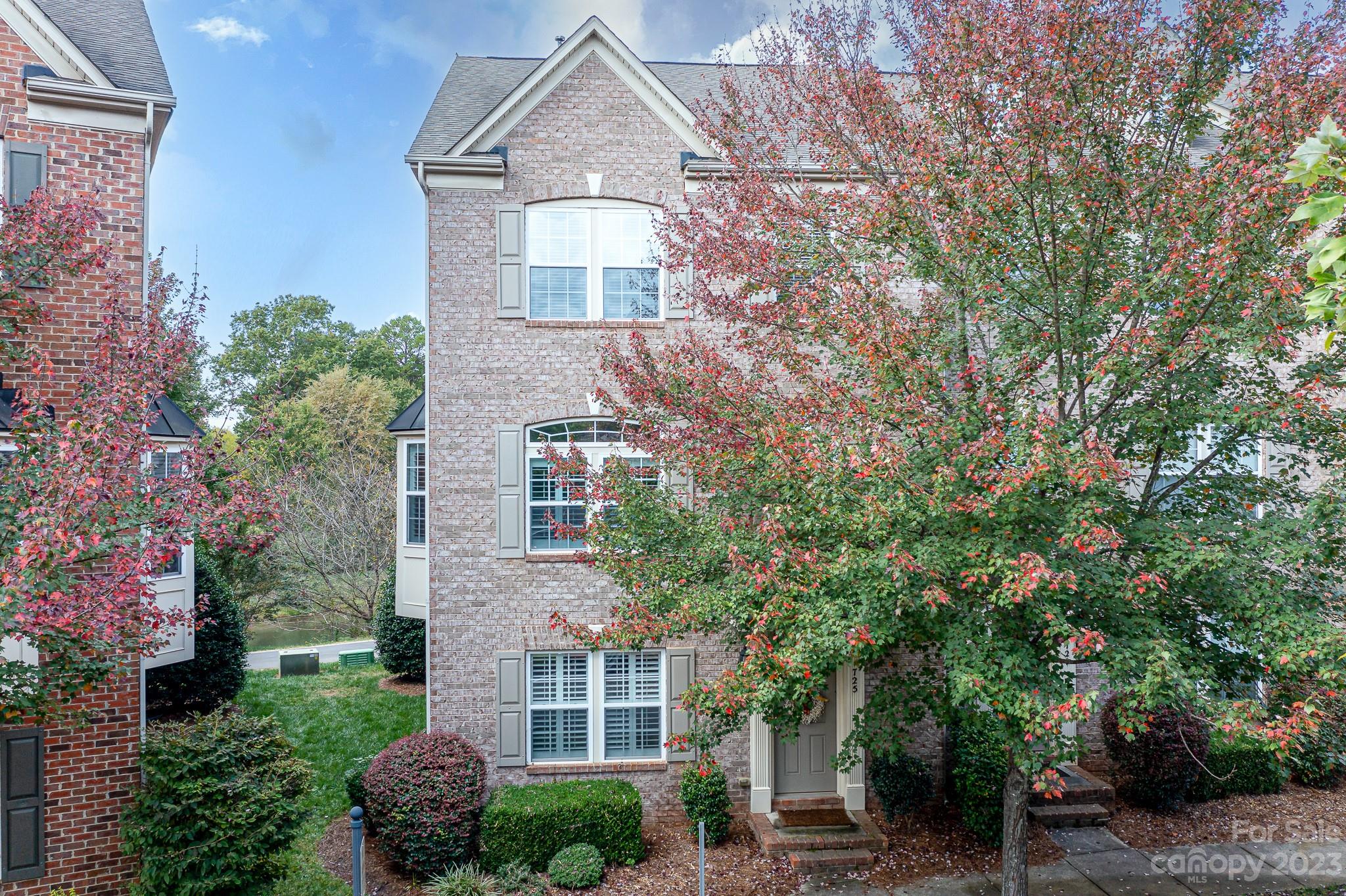 725 Naramore Street Davidson, NC 28036 - Photo 2 of 27 a front view of a house with a yard
