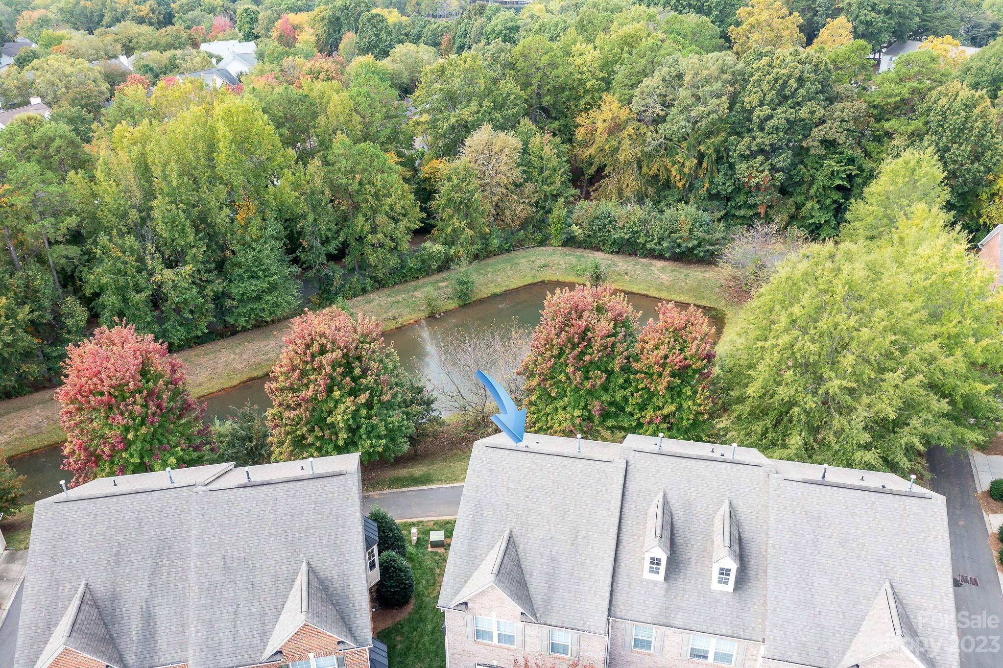 725 Naramore Street Davidson, NC 28036 - Photo 25 of 27 an aerial view of a house with a yard
