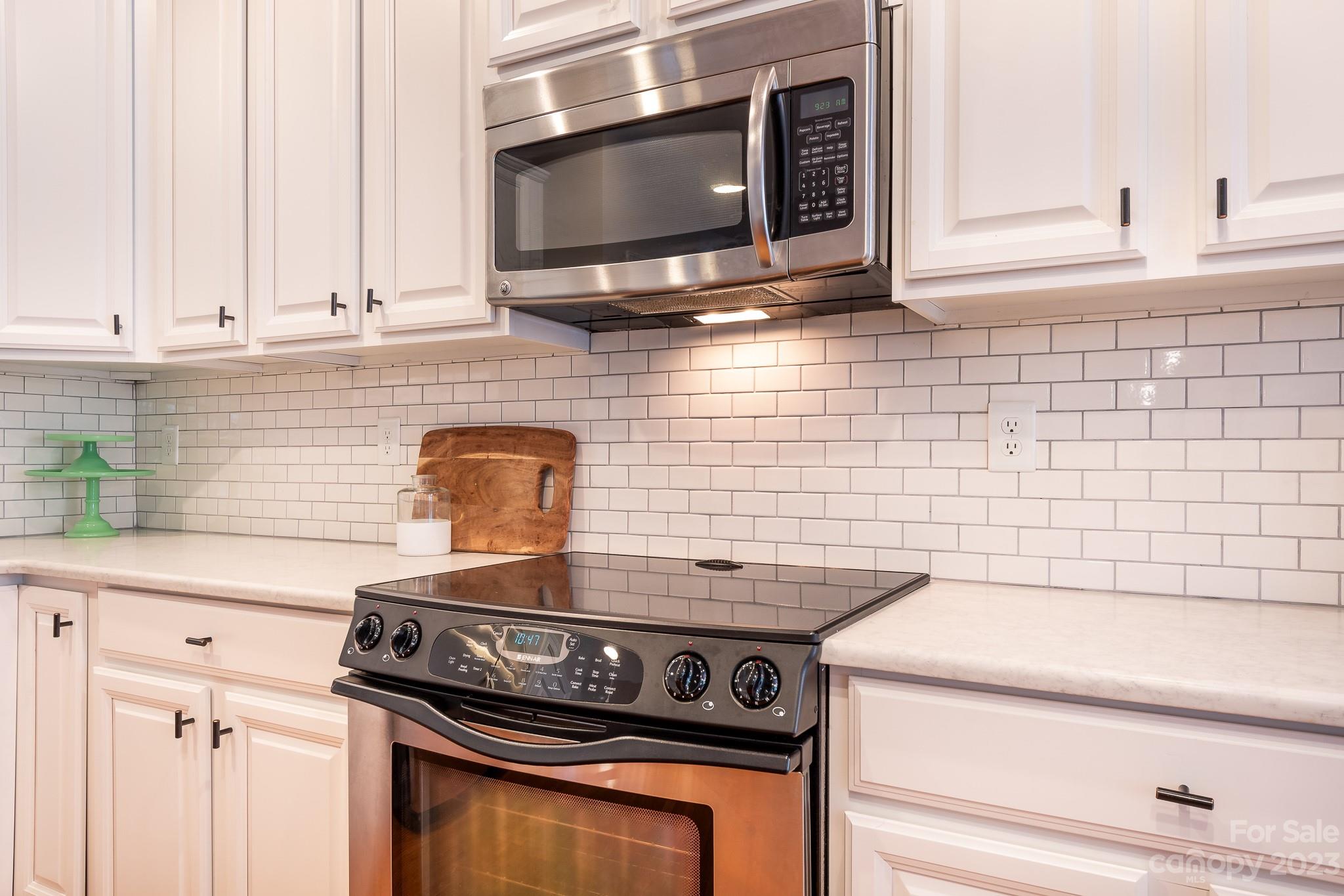725 Naramore Street Davidson, NC 28036 - Photo 6 of 27 a stove top oven sitting inside of a kitchen
