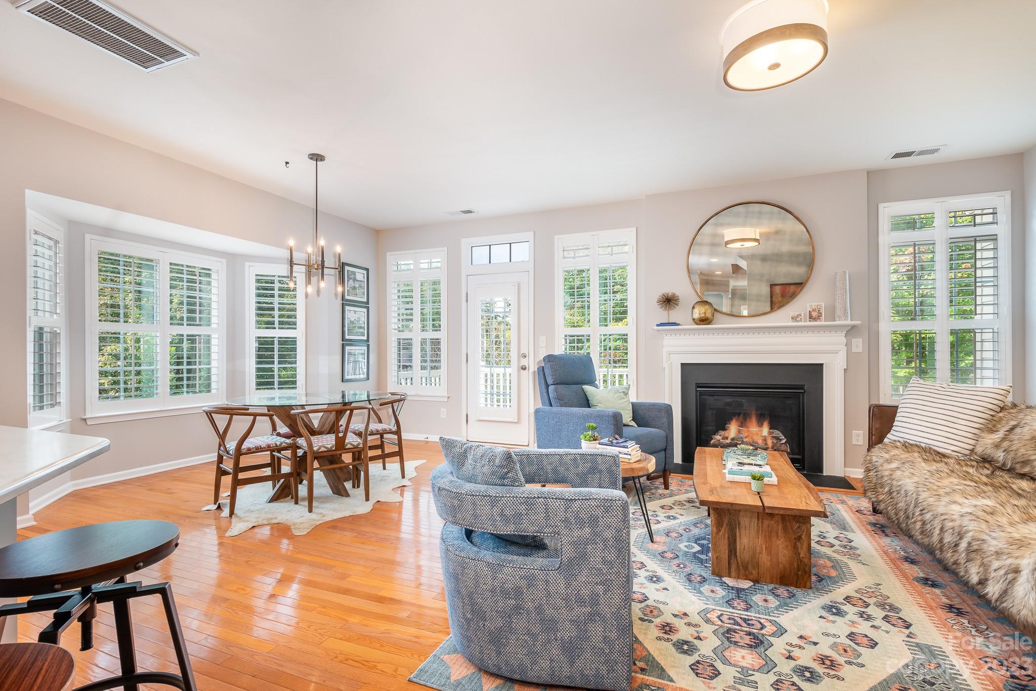 725 Naramore Street Davidson, NC 28036 - Photo 9 of 27 a living room with furniture and a fireplace