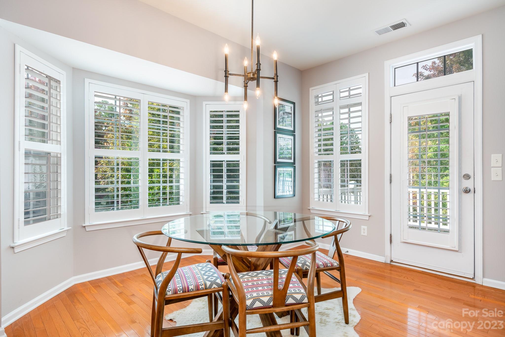 725 Naramore Street Davidson, NC 28036 - Photo 10 of 27 a dining room with furniture and windows