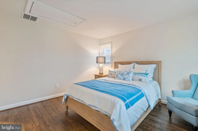 a view of an empty room and wooden floor