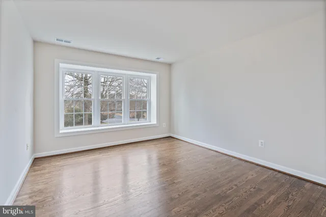 a balcony with wooden floor