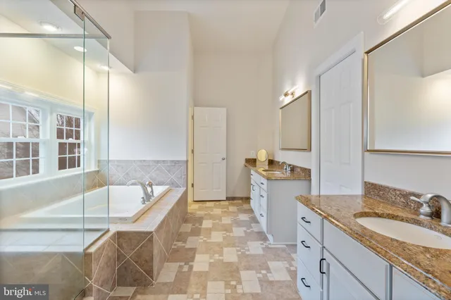 an aerial view of a residential houses with outdoor space