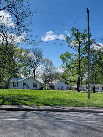 a view of a house with a big yard